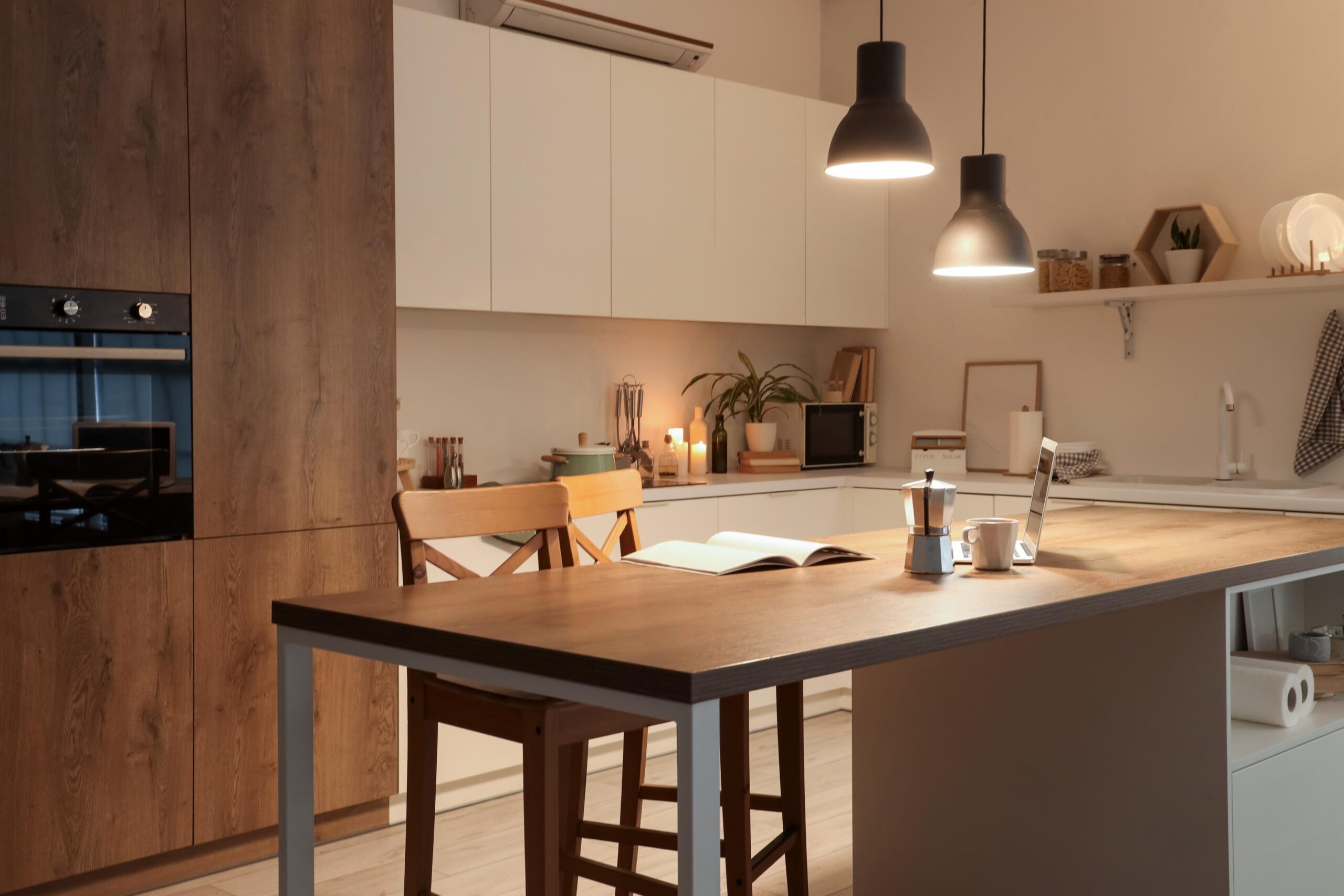 Kitchen with dining table and warm lighting