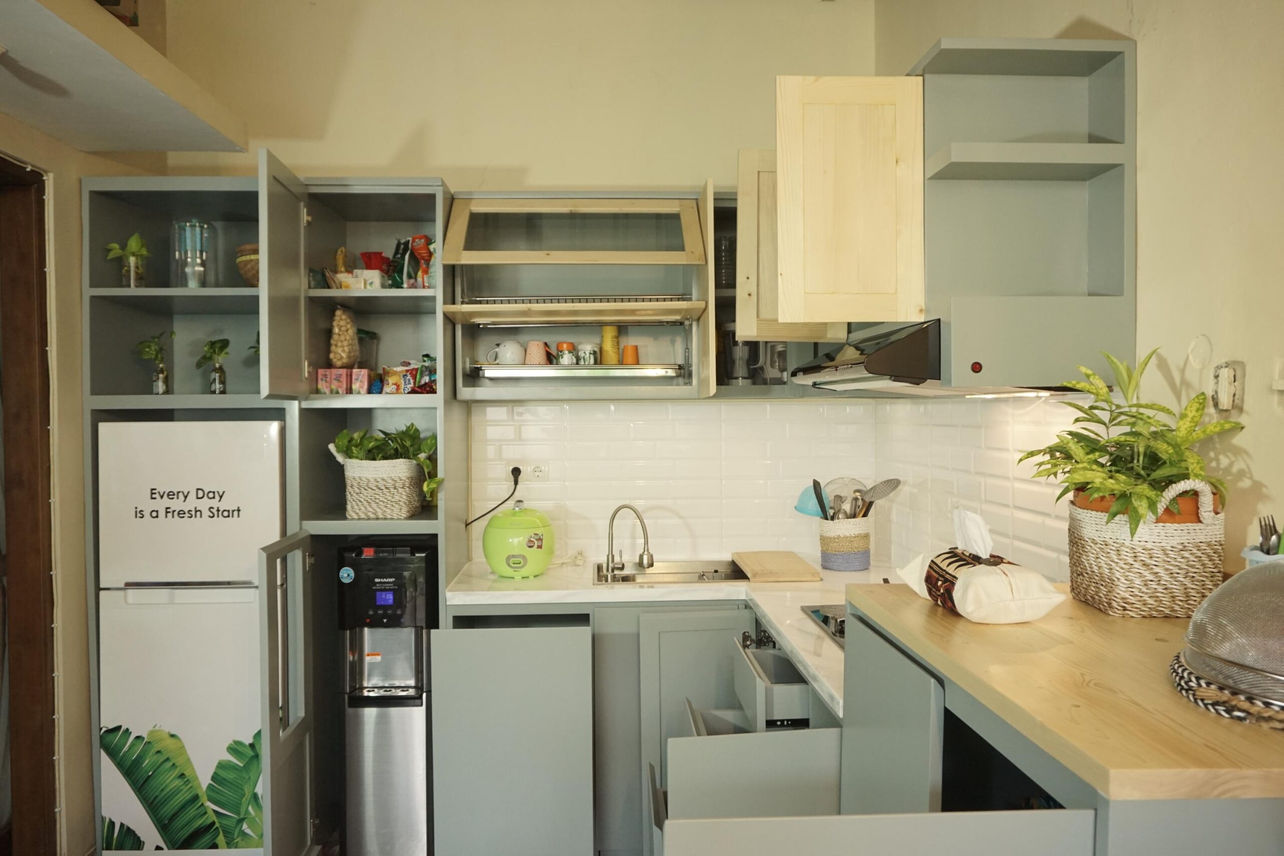 Indo-fusion kitchen interior design with traditional elements and contemporary cabinetry