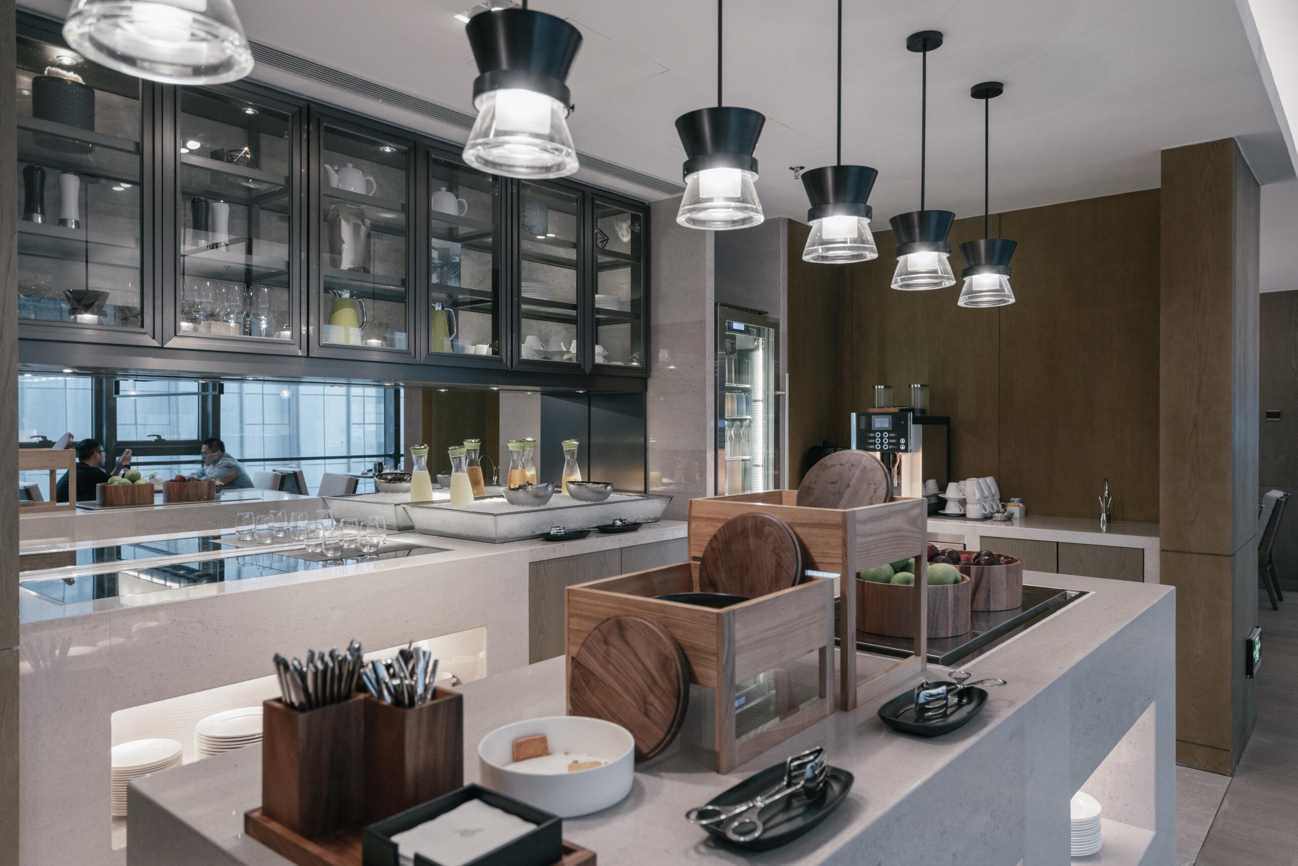 Modern Indian kitchen style featuring earthy tones, wooden finishes, and contemporary interiors